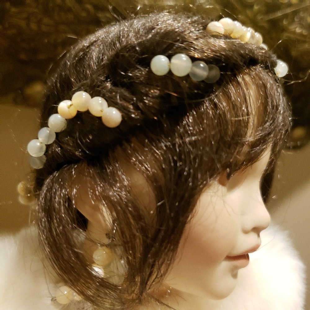 Hand crafted porcelain doll bust.